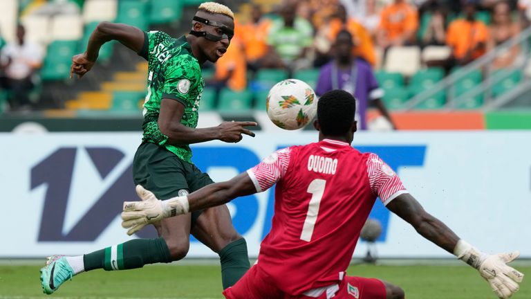 Nigeria&#39;s Victor Osimhen, left, kicks the ball against Equatorial Guinea&#39;s goalkeeper Jesus Owono during the African Cup of Nations Group A soccer match between Nigeria and Equatorial Guinea&#39;s in Abidjan, Ivory Coast, Sunday, Jan. 14, 2024. (AP Photo/Sunday Alamba)