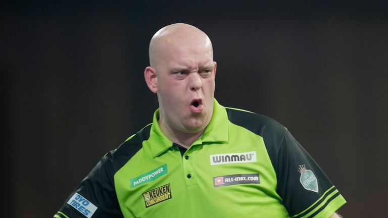 Michael van Gerwen of Netherlands reacts during the quarterfinal match against Scott Williams of England at the World Darts Championship, in London, Monday, Jan. 1, 2024. (AP Photo/Kin Cheung)


