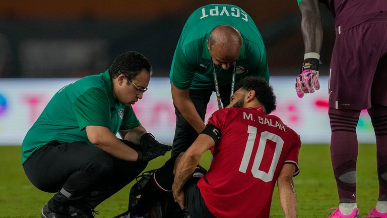 Egypt&#39;s Mohamed Salah receives medical treatment during the African Cup of Nations Group B soccer match between Egypt and Ghana in Abidjan, Ivory Coast, Thursday, Jan.18, 2024. (AP Photo/Themba Hadebe)