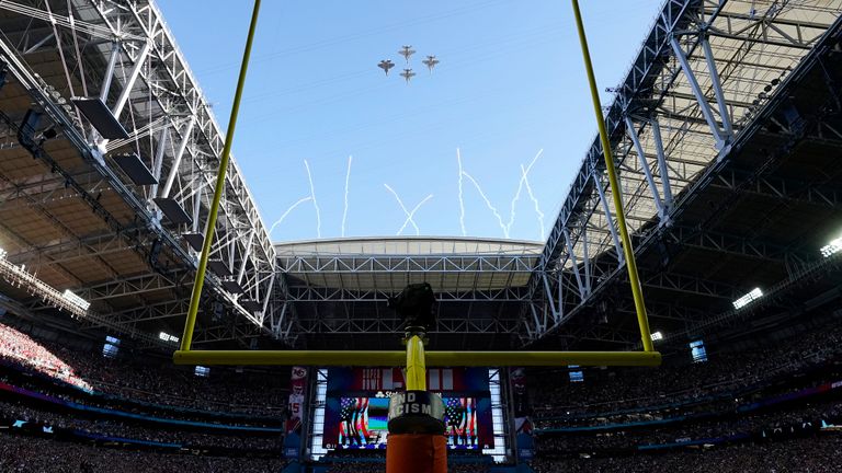 The first all-female piloted military flyover, commemorating 50 years of women flying in the U.S. Navy, flies over State Farm Stadium before the NFL Super Bowl 57 football game between the Kansas City Chiefs and the Philadelphia Eagles, Sunday, Feb. 12, 2023, in Glendale, Ariz. (AP Photo/Ashley Landis)


